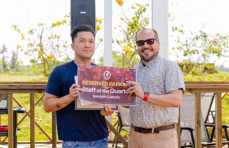 NMC Staff of the Quarter award recipient Kenneth Gabrido (left) with NMC President Galvin Deleon Guerrero, EdD, (right).