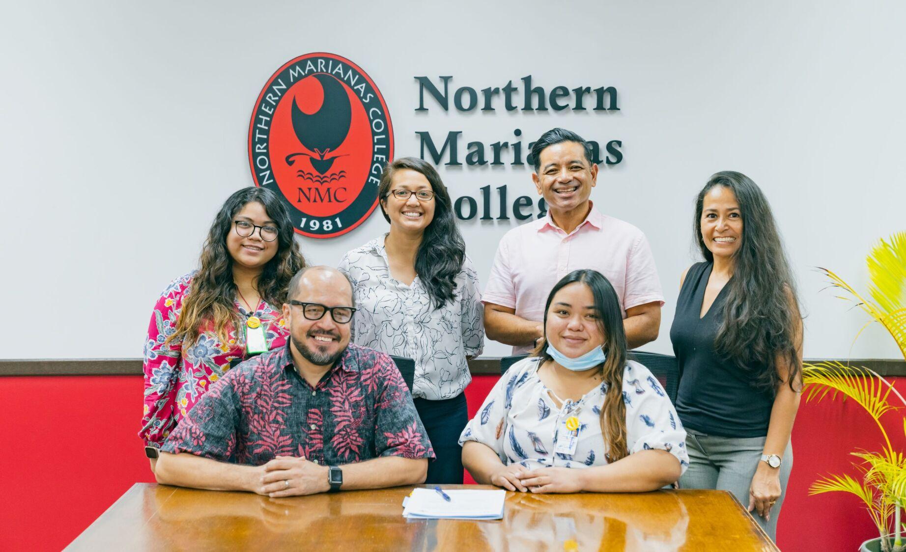 The Commonwealth Healthcare Corp. and Northern Marianas College signed a partnership agreement on July 6, 2021. Standing, from left: Brianna Fajardo, CHCC community outreach specialist; Patricia Coleman, NMC interim dean; Frankie Eliptico, NMC vice president; Tayna Belyeu-Camacho, certified cessation facilitator. Seated: Dr. Galvin Deleon Guerrero, NMC president; and Jolanie Tenorio, CHCC project assistant.