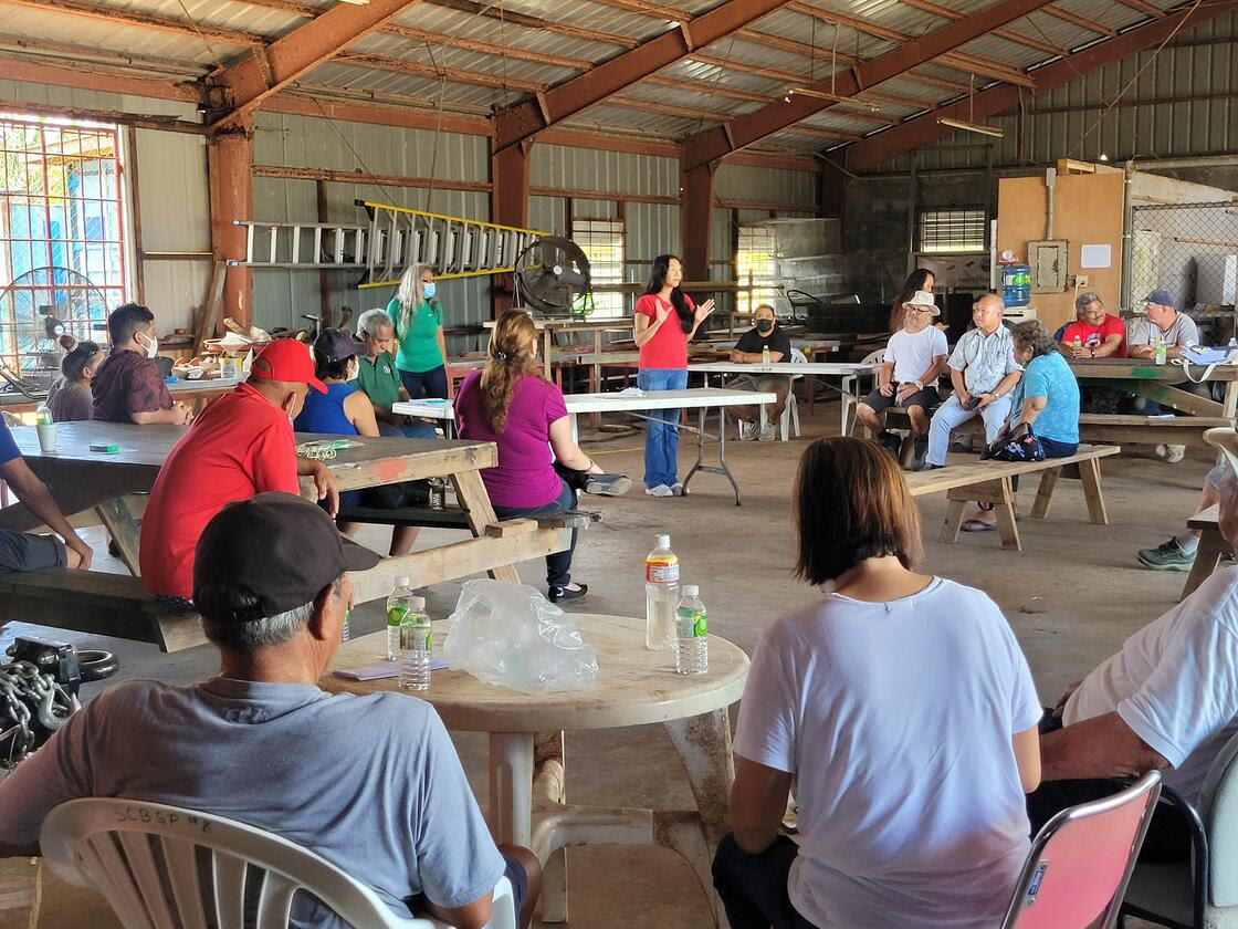 Attendees of the information session hosted by the CNMI Department of Lands and Natural Resources listen to Department of Commerce Coordinator for Economic Development Jo Anna Ada discuss a grant program available to farmers.