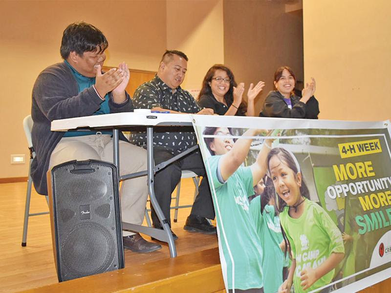 Gov. Ralph DLG Torres, second from left, signs the proclamation designating Oct. 2-8, 2022, as National 4H Week. He is joined by 4-H Marianas State Youth Council president Rownel Jody Coloma, Northern Marianas College-Cooperative Research, Extension, and Education Services interim dean Patricia Coleman, and 4-H Saipan Youth Council vice president Raina Avelino. (LEIGH GASES)