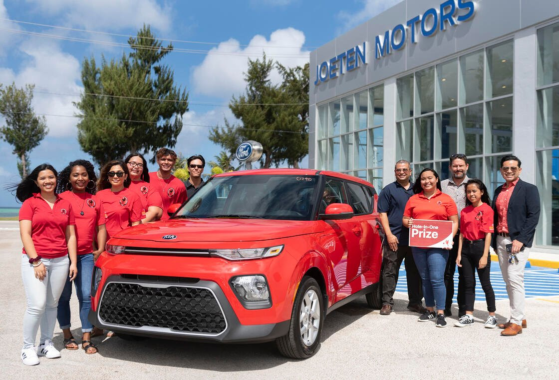 Joeten Motors has announced that it is offering a brand new 2020 Kia Soul as a hole-in-one prize in the upcoming 16th Annual NMC Foundation Golf Tournament. In this pre-pandemic photo are NMC students along with NMC Interim President Frankie Eliptico and Joeten Motors representatives Matthew Deets, Boss Alvarez, and Peter Tenorio.